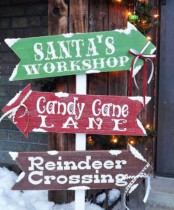 an arrangement of Christmas signs in green, red and burgundy, with white letters is a lovely decor idea for Christmas