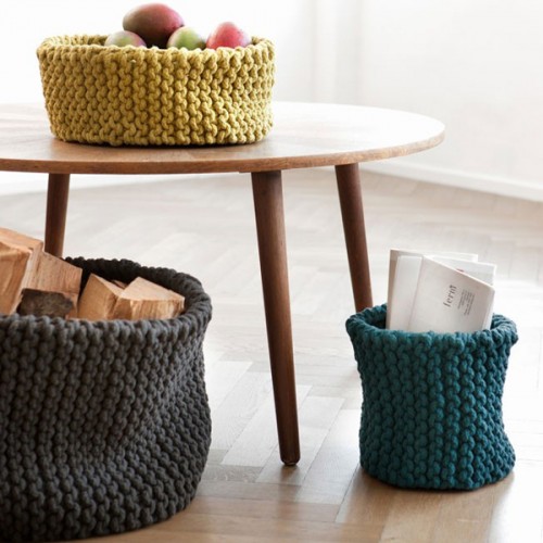 chunky crochet baskets of various colors can be used for storage and decorating spaces, they will give a touch of color and a cozy feel to the room
