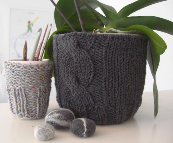planters dressed up with grey and black cozies with sweater patterns are amazing for home decor, they will bring coziness and a welcoming feel to the space