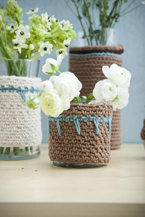 simple clear glass vases dressed up with white and brown chunky knit cozies look catchier and prettier and scream fall and winter