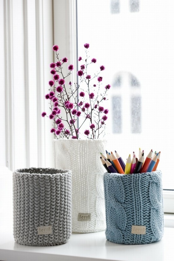 a planter, a pencil holder and a vase all dressed up with matching but differently colored chunky knit cozies look very cool, cozy and chic