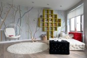 a cotnemporary teen bedroom with a bright accent wall, a quirky upholstered bed and console table, a sheer hanging chair and a storage unit on the wall