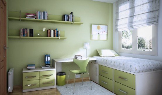 a pretty green teen room with a light green wall, some cabinets, a desk and a bed with drawers plus wall-mounted shelves