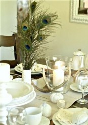 white porcelain, linens, pumpkins and candles plus antlers make up a chic and stylish Thanksgiving tablescape in neutrals