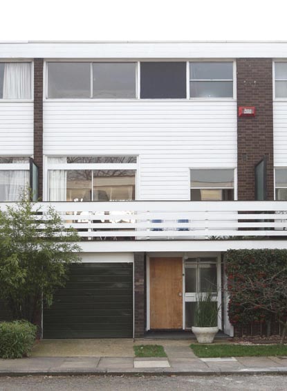 Terraced House with Integrated Garage and Extensive Glazing