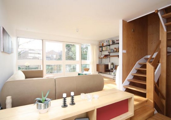 Terraced House with Integrated Garage and Extensive Glazing - DigsDigs