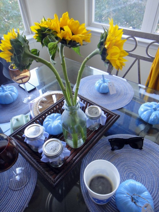 light blue pumpkins and blue textile placemats can be used to spruce up your modern Thanksgiving tablescape