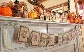 a rustic Thanksgiving mantel with bold dried leaves, porcelain pumpkins, dolls, a paper garland with letters is a cool idea for fall