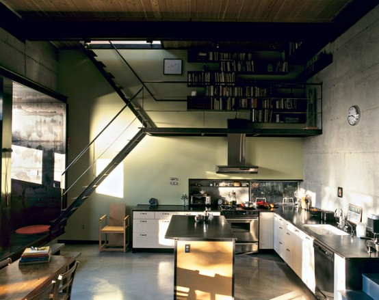 This very thin staircase combined is part of the house designed by architects Annie Han and Daniel Mihalyo. It’s combined with a cooking hood and a book storage system so it serves different purposes at once.
