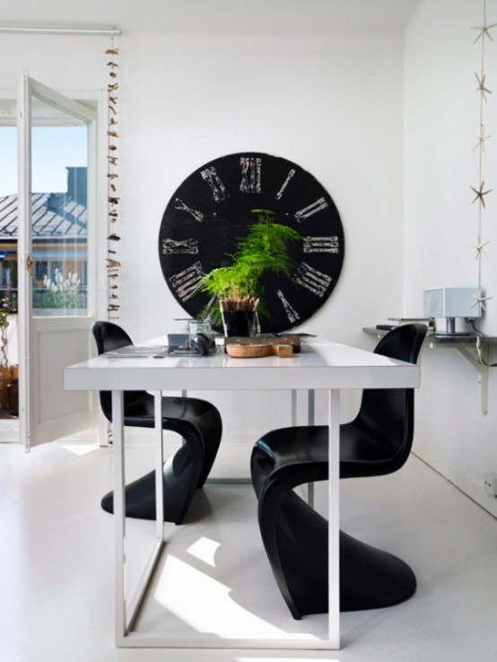 Tiny Black And White Studio With Wood Accents