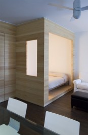 Tiny Studio Organized With A Smart Storage Wall