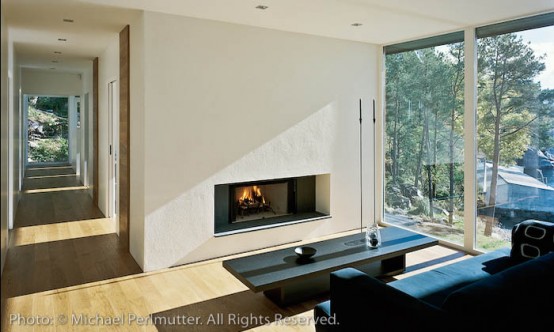 Twofold House In Black Stained Wood With Natural Wood Between The Window Partitions