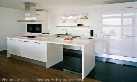 Twofold House In Black Stained Wood With Natural Wood Between The Window Partitions