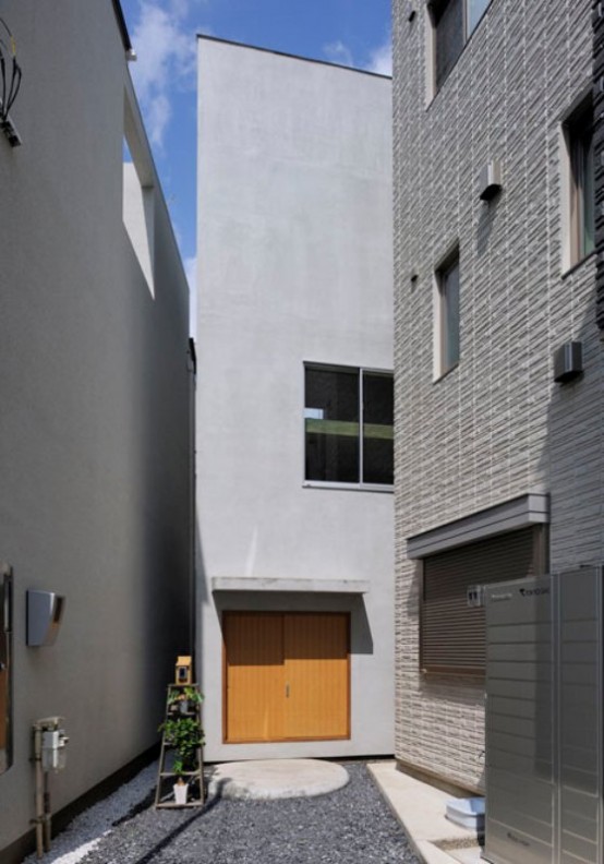 Ultra Minimalist House With Ladders Connecting Strories