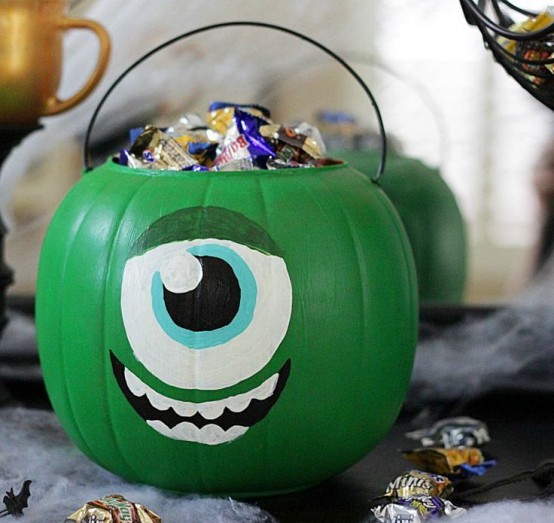 a green pumpkin monster filled with candies is inspired by Monster Corporation and looks super cool