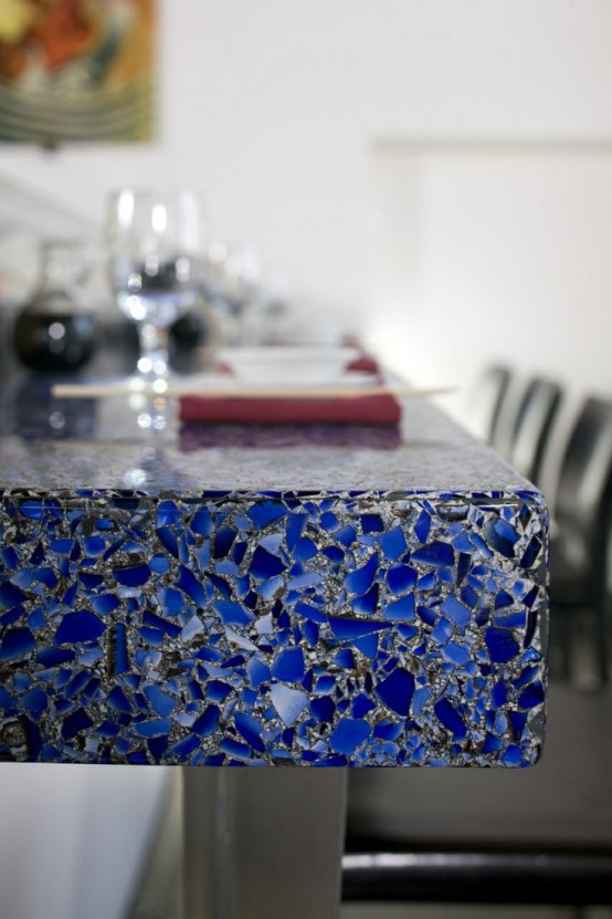 a bold blue mosaic coutertop with a touch of sparkle is a cool idea for a modern space