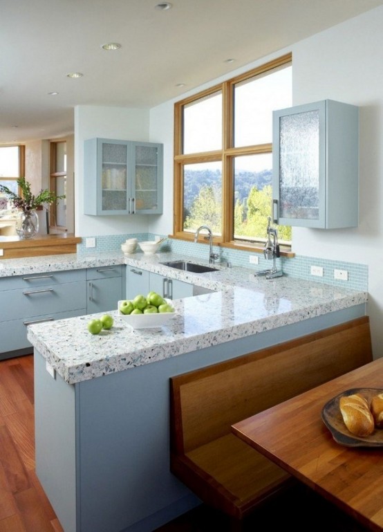 light blue cabinets and matching terrazzo countertops plus a matching tile backdsplash for a dreamy and tender kitchen