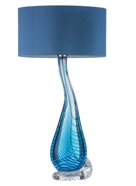 a blue table lamp with a unique ombre glass base and a navy lampshade is a stylish idea with much color