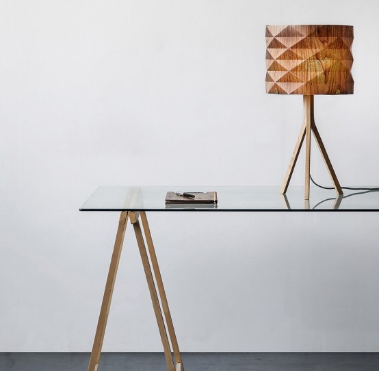 a stylish table lamp with a geometric faceted lampshade and a simple wooden base for adding a natural touch to the space