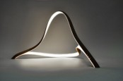 a creative curved LED lamp is a perfect fit for a modern or minimalist space that will bring a shape to the space