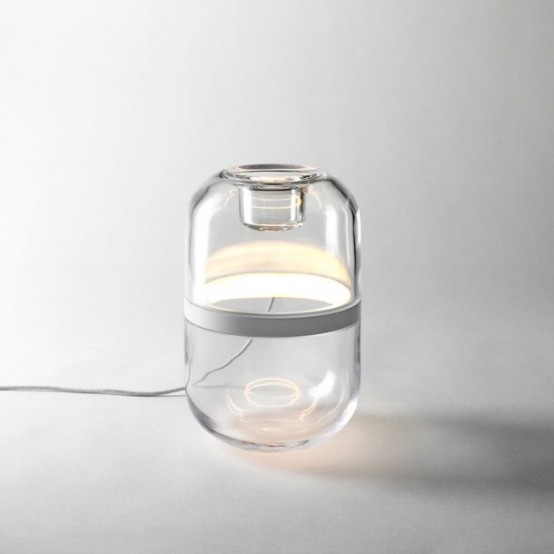 a minimalist glass table lamp looks as a capsule with a stripe is a cool idea for a contemporary or minimal space