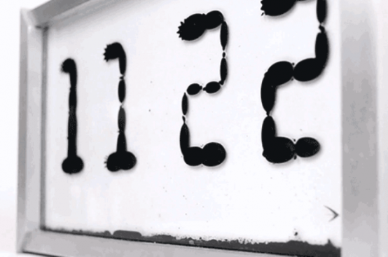 Unique Fluid Ferrolic Clock That Shows Time Flows
