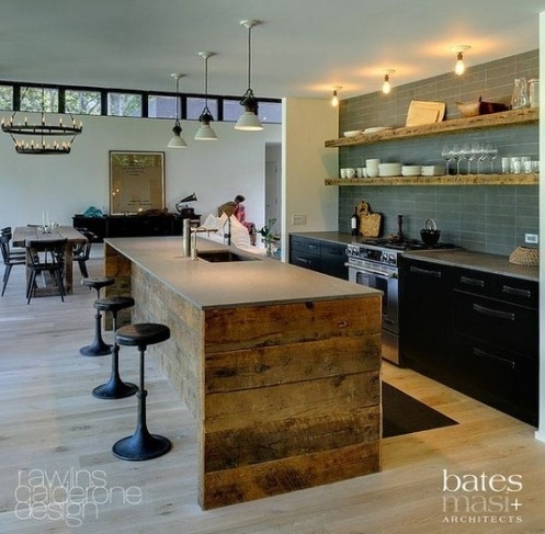 a rough pallet wood kitchen island with a concrete tabletop and a built-in sink is a cool contemporary meets rustic idea