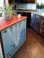 a colorful mosaic kitchen island with a bright countertop and a beautiful patterned base looks very artistic