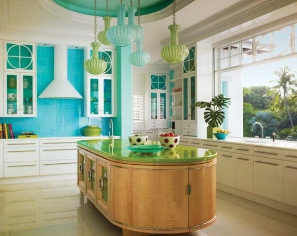 a stained wood curved kitchen island with much storage space and a green countertop stands out with its color and shape