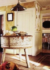 a small shabby chic round kitchen island with carved legs is a simple and casual idea for a shabby space