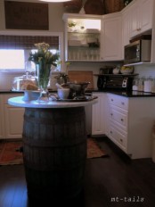 a creative kitchen island made of a barrel and a tabletop is unusual and simple to make