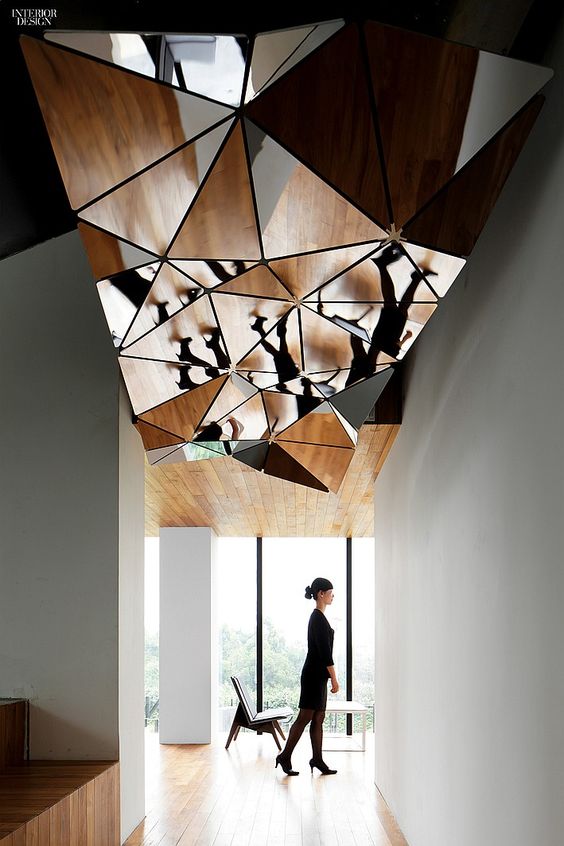a cracked geometric mirror attached to the ceiling will give more light to the space and will make it more eye-catchy and interesting