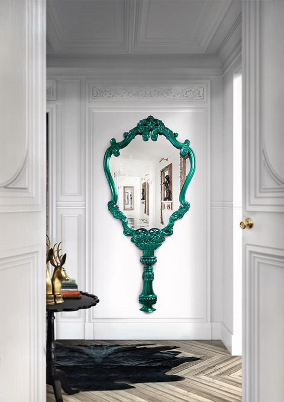 a fantastic mirror inspired by vintage hand mirrors, with a green frame and handle is a lovely idea for a refined entryway or a chic closet