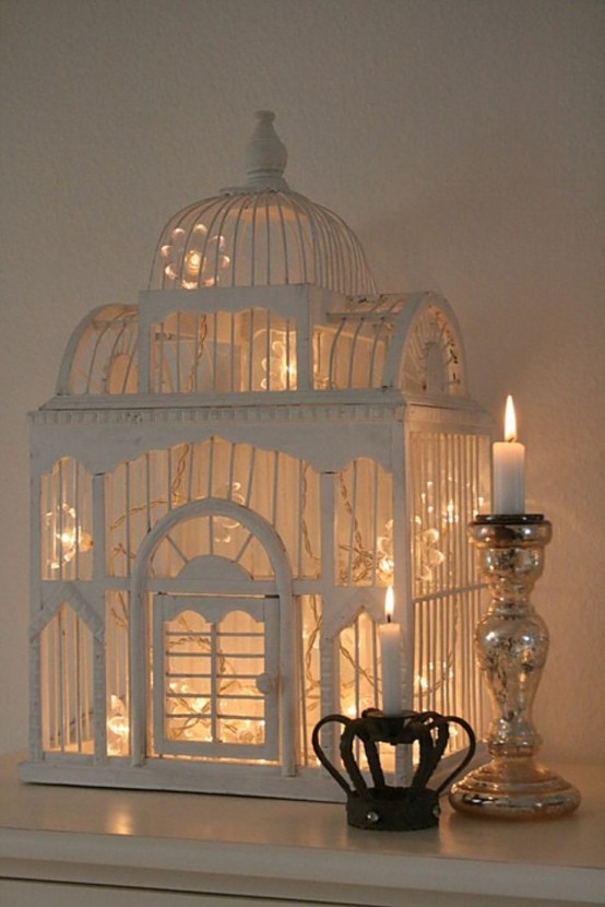 As a part of your Holiday decor stuff some Christmas lights into a cage and light them up!