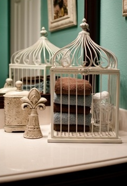 Yes, you can make a vintage towel holder from a bird cage.