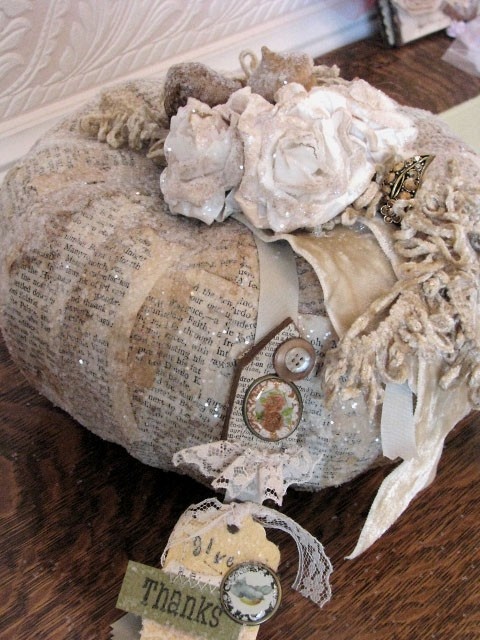 a vintage decoupage pumpkin with ribbons and brooches, some lace and buttons is a pretty Thanksgiving decoration to make