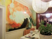 a bold orange accent wall is a cool idea for a neutral space, it will bring a lot of color and interest to the space
