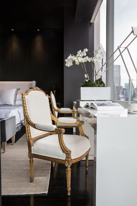 a contemporary black and white bedroom with black walls, a white upholstered bed, a white desk, a neutral antique chair and a panoramic window with a gorgeous view