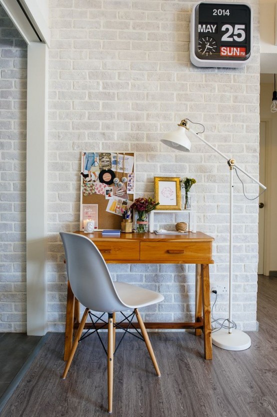 a cute little working nook with an ikea floor lamp