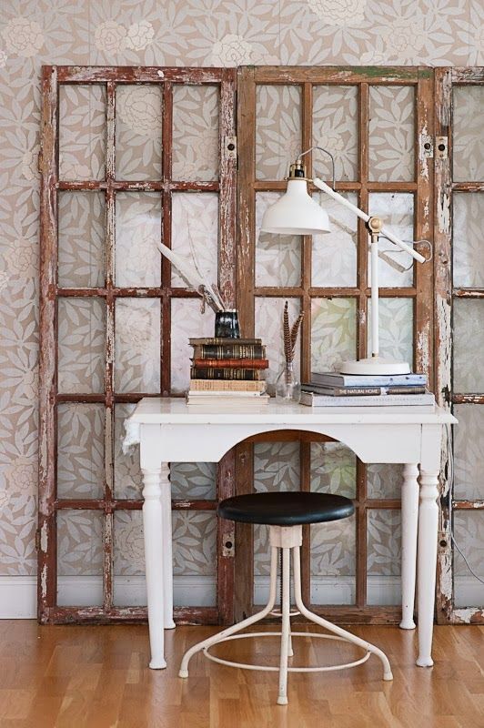 a shabby chic home office nook with window frames, a vintage desk, stool and an IKEA Ranarp lamp that perfectly matches the space