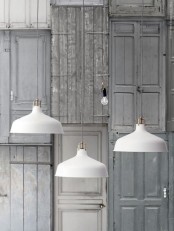 a cluster of white Ranarp pendant lamps can be used in any space, whether it’s an entryway or a kitchen