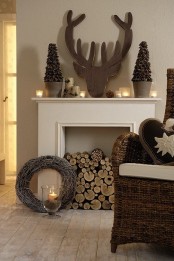 a non-working fireplace can be filled with firewood to make it cozier and you can style the mantel in some cute way, too