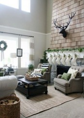 lots of fresh greenery in decor, firewood in a basket and some green elements to echo with the greenery refresh the space