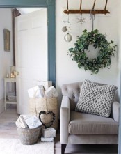 a fresh greenery wreath will make your living room fele more like outdoors and will refresh the space for the holidays