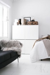 Stacked IKEA Besta units in a bedroom