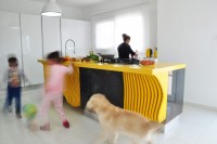 white-minimalist-kitchen-with-a-sculptural-yellow-island-4
