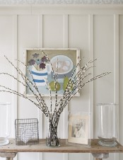 a clear glass vase with willow can be placed anywhere in your home to bring a spring and Easter feel