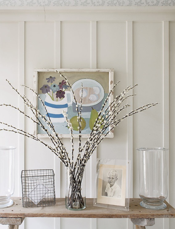 a clear glass vase with willow can be placed anywhere in your home to bring a spring and Easter feel
