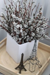 a square porcelain pot with willow is a nice and modern idea to decorate your home for spring