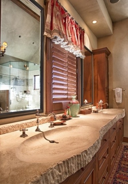 a long live edge stone vanity top with sinks is a chic idea for a rustic bathroom, it adds a bit of edge